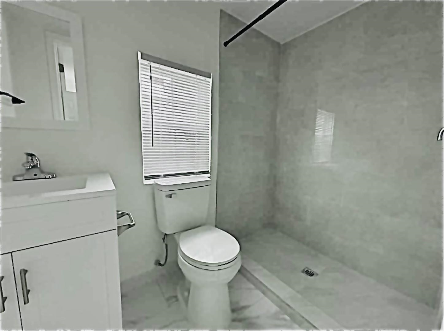 3442 Carrington Road Memphis, TN 38111 - Photo 13 of 25 Full bath featuring toilet, tiled shower, marble finish floor, and vanity