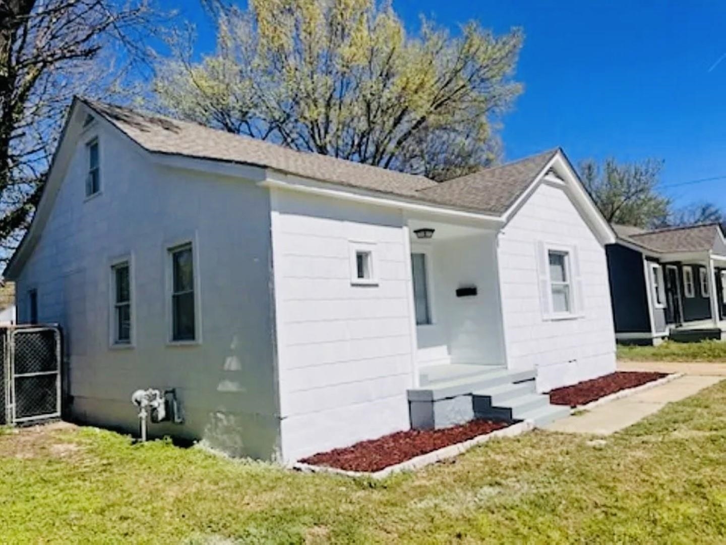 3442 Carrington Road Memphis, TN 38111 - Photo 3 of 25 View of property exterior featuring roof with shingles, a gate, and a lawn