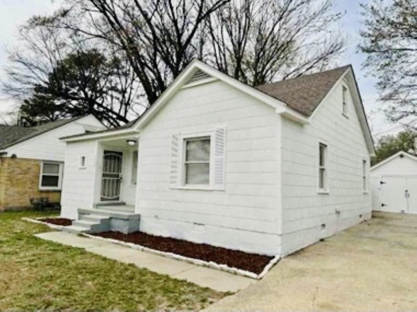 3442 Carrington Road Memphis, TN 38111 - Photo 4 of 25 Bungalow featuring concrete driveway, crawl space, an outdoor structure, and a detached garage
