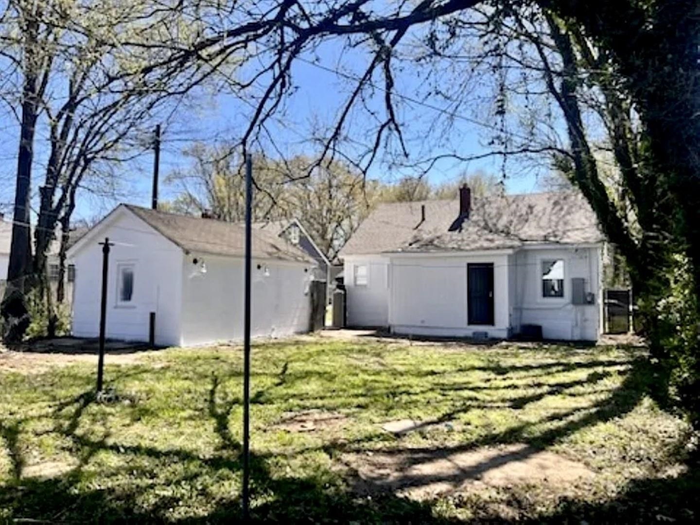 3442 Carrington Road Memphis, TN 38111 - Photo 5 of 25 Back of house featuring a yard and an outdoor structure