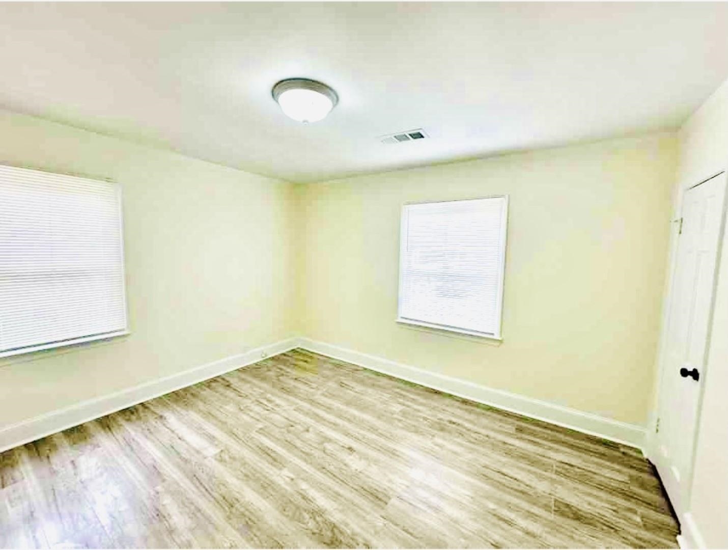 3442 Carrington Road Memphis, TN 38111 - Photo 8 of 25 Empty room featuring wood finished floors, baseboards, and visible vents