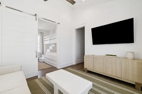 a bathroom with a double vanity sink toilet mirror and shower