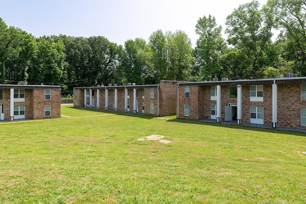 3236 Millington Road Memphis, TN 38127 - Photo 23 of 31 Brick exterior buildings featuring multiple windows and a flat roofline