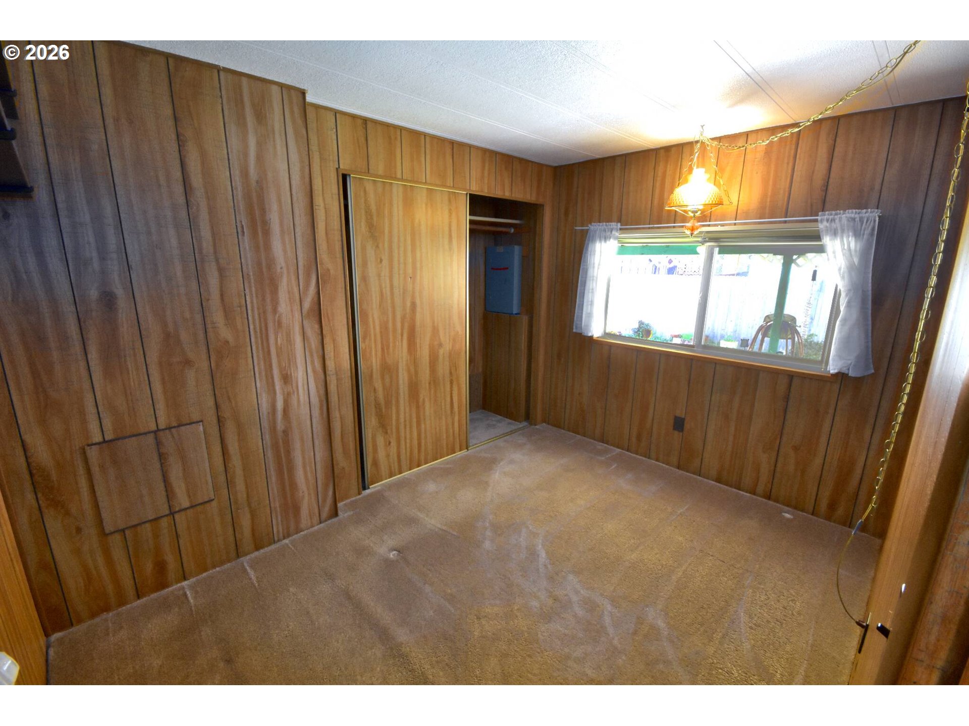 569 South 51st Place Springfield, OR 97478 - Photo 16 of 40 a view of an empty room with window and closet area