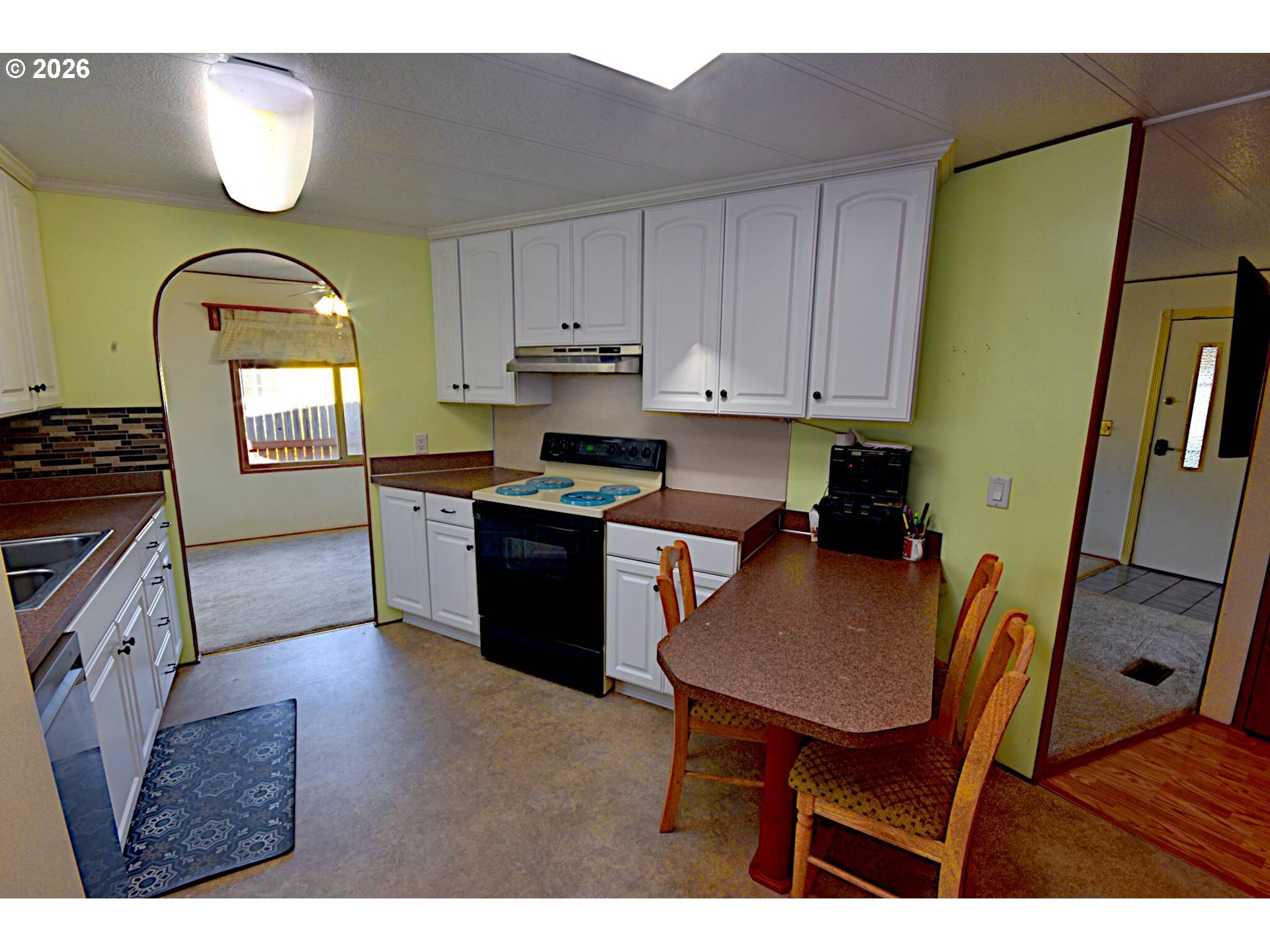 569 South 51st Place Springfield, OR 97478 - Photo 2 of 40 a kitchen with stainless steel appliances granite countertop a stove a sink dishwasher and cabinets with wooden floor