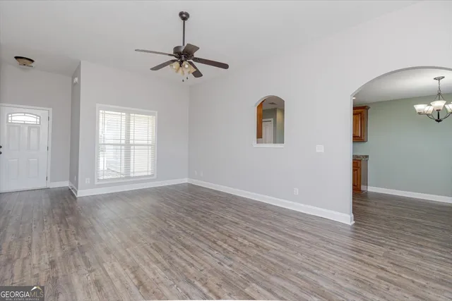 a kitchen with stainless steel appliances granite countertop a stove and a microwave