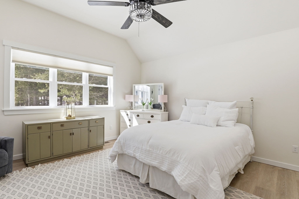 7 Crane Landing Road Wareham, MA 02571 - Photo 12 of 40 a large white bed sitting in a bathroom next to a window