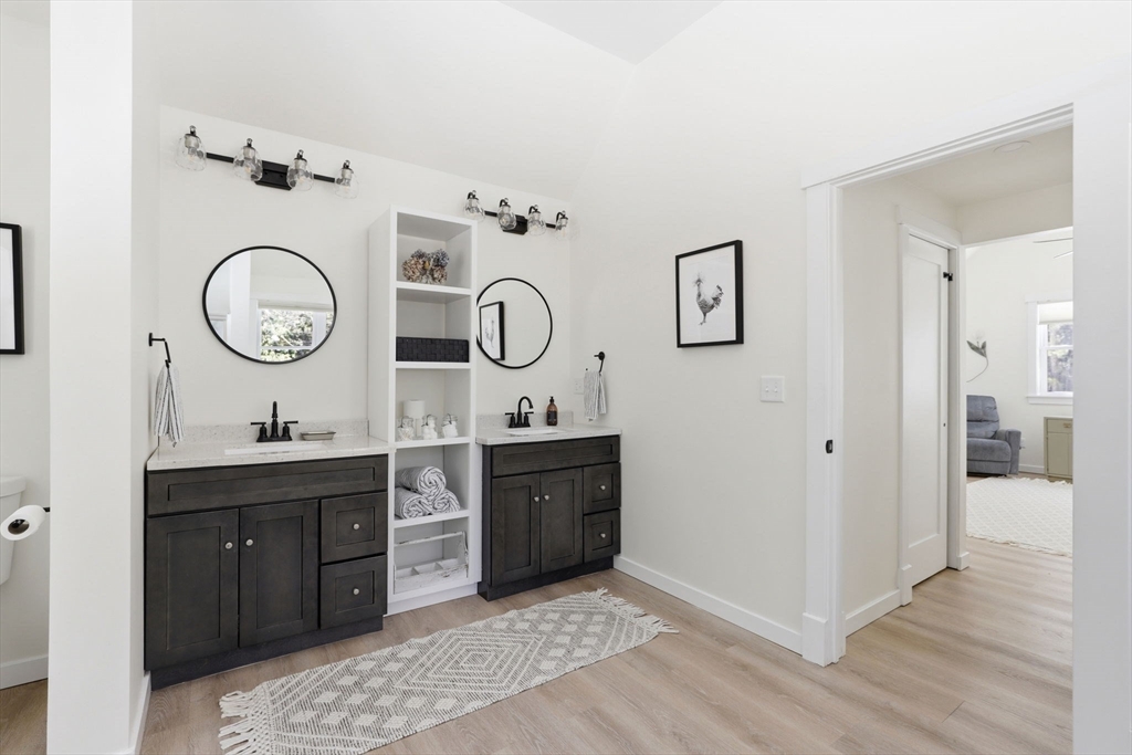7 Crane Landing Road Wareham, MA 02571 - Photo 13 of 40 a view of a bathroom with sink mirror and wooden floor