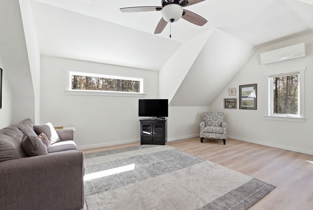7 Crane Landing Road Wareham, MA 02571 - Photo 18 of 40 a living room with furniture and a flat screen tv