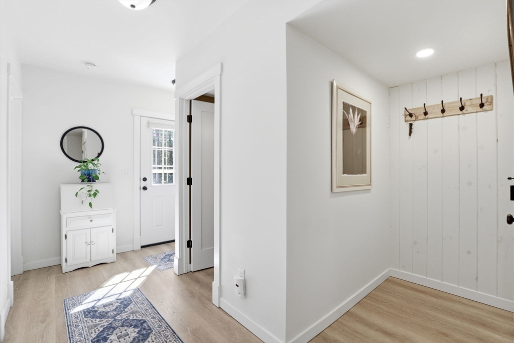 7 Crane Landing Road Wareham, MA 02571 - Photo 21 of 40 a view of a hallway with closet and wooden floor