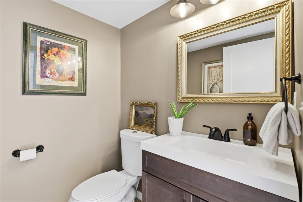 7 Crane Landing Road Wareham, MA 02571 - Photo 22 of 40 a bathroom with a toilet a sink and mirror