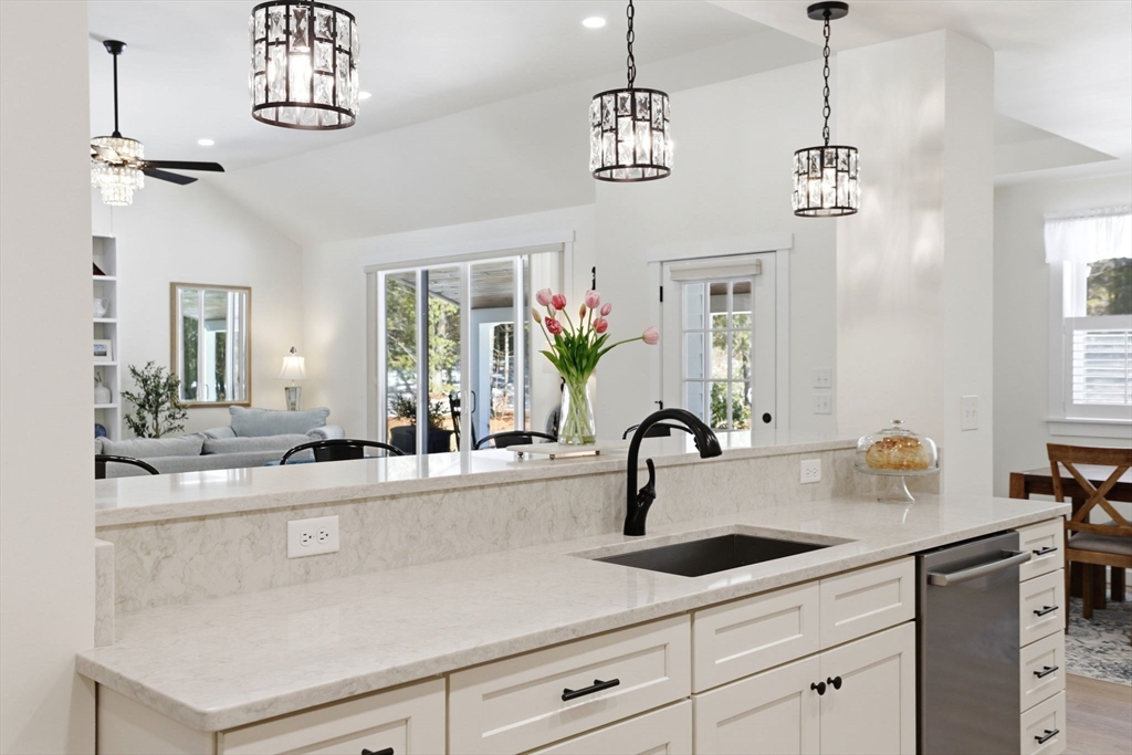 7 Crane Landing Road Wareham, MA 02571 - Photo 5 of 40 a kitchen with a sink a counter and cabinets