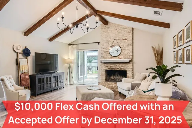 a view of living room with furniture and a fireplace