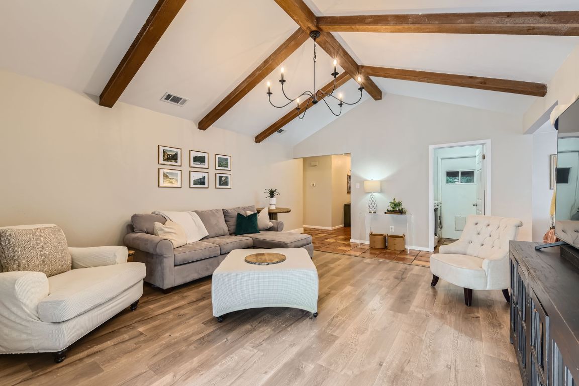 13223 Broadmeade Avenue Austin, TX 78729 - Photo 10 of 39 a living room with furniture and a ceiling fan