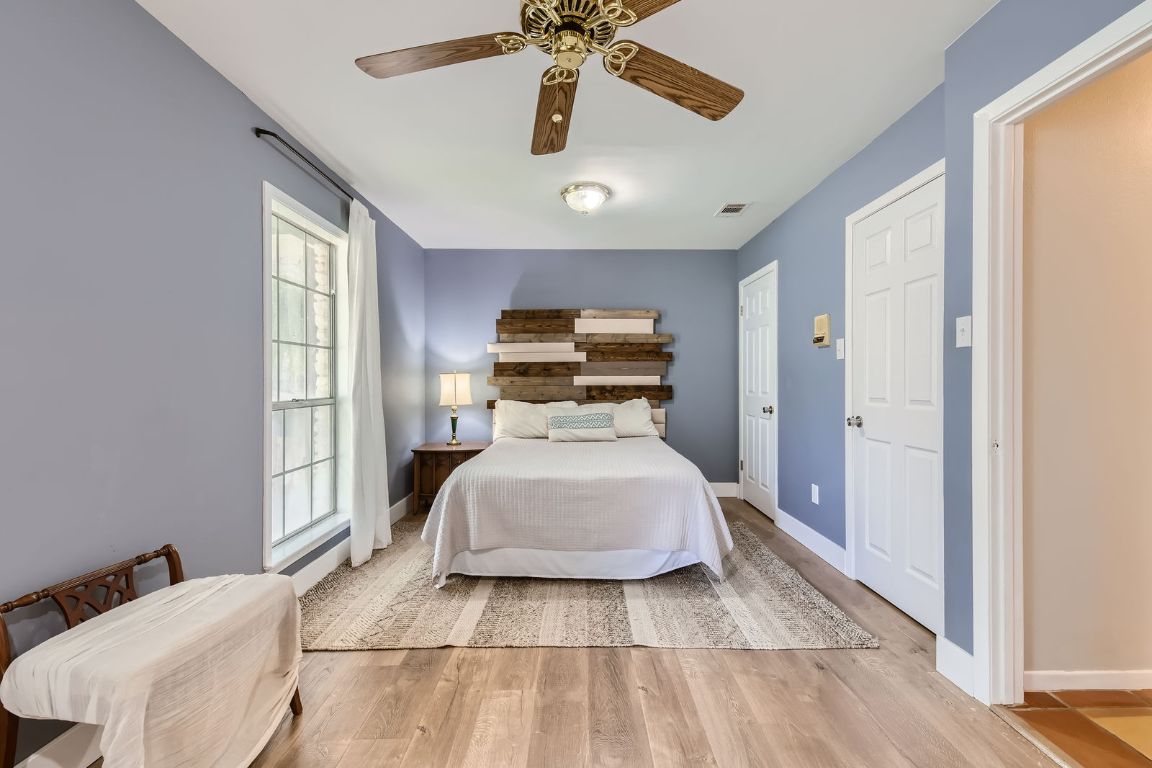 13223 Broadmeade Avenue Austin, TX 78729 - Photo 18 of 39 a bed room with a bed and window
