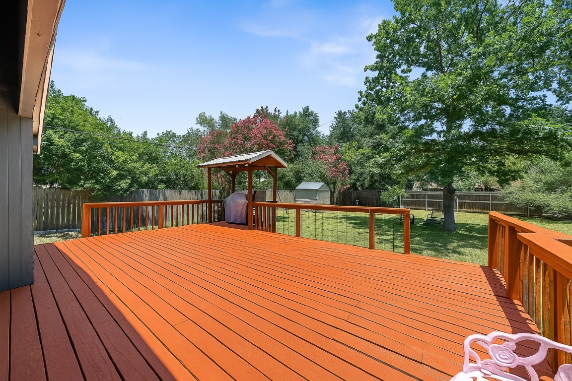 13223 Broadmeade Avenue Austin, TX 78729 - Photo 25 of 39 a balcony with wooden floor and fence