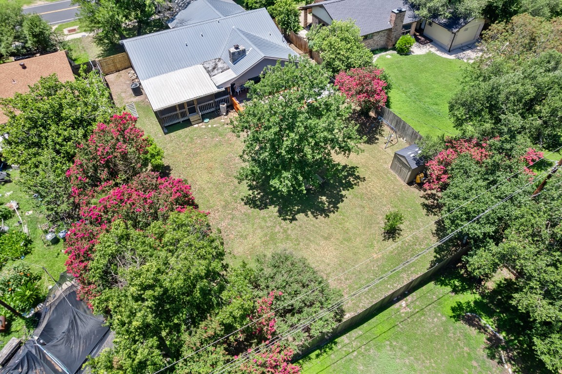 13223 Broadmeade Avenue Austin, TX 78729 - Photo 32 of 39 an aerial view of a house with a yard and garden