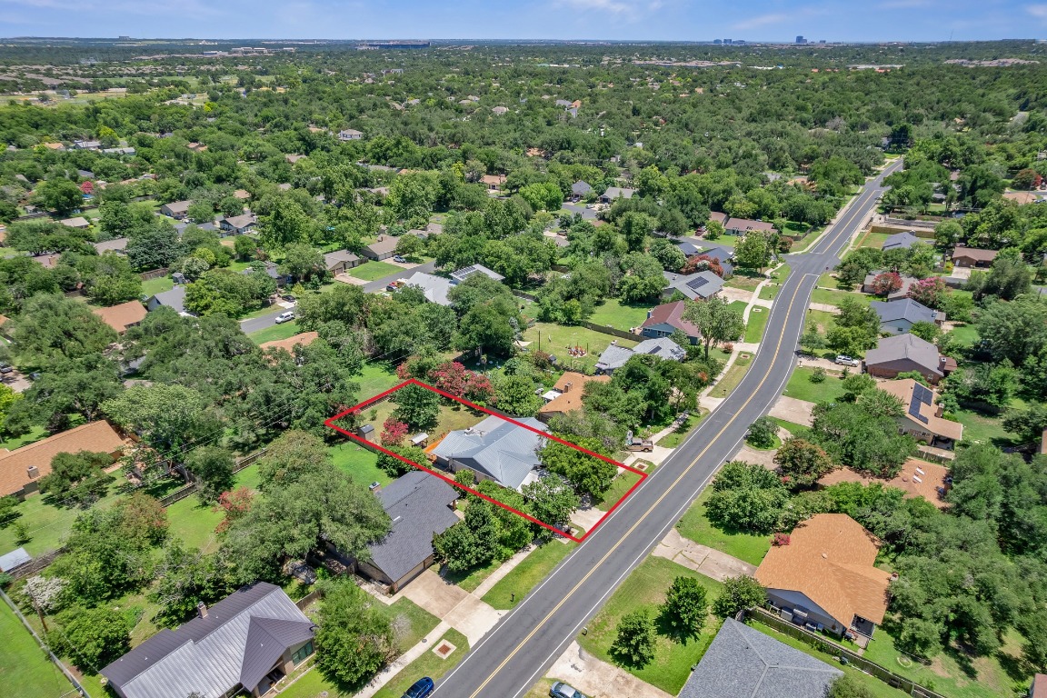 13223 Broadmeade Avenue Austin, TX 78729 - Photo 34 of 39 an aerial view of a house with a yard