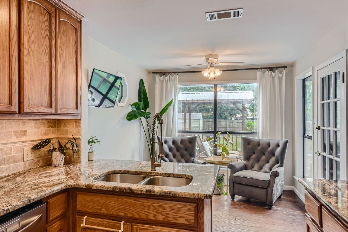 13223 Broadmeade Avenue Austin, TX 78729 - Photo 3 of 39 a kitchen with a sink and a large window
