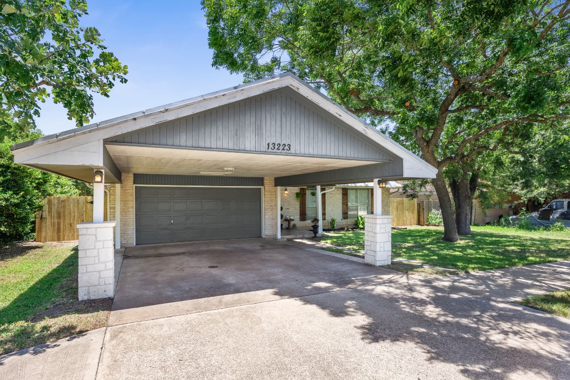 13223 Broadmeade Avenue Austin, TX 78729 - Photo 7 of 39 a front view of a house with garden