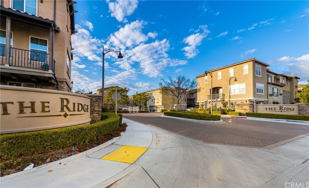 45 Aliso Ridge Loop Mission Viejo, CA 92691 - Photo 1 of 1 a view of a street with a building in the background