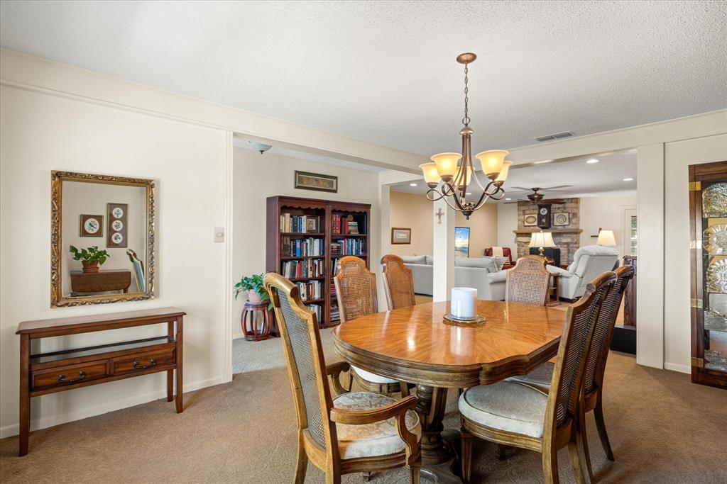 17305 Highway 281 Hico, TX 76457 - Photo 16 of 28 a view of a dining room with furniture and a chandelier