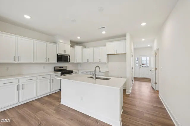 a bathroom with a sink and mirror