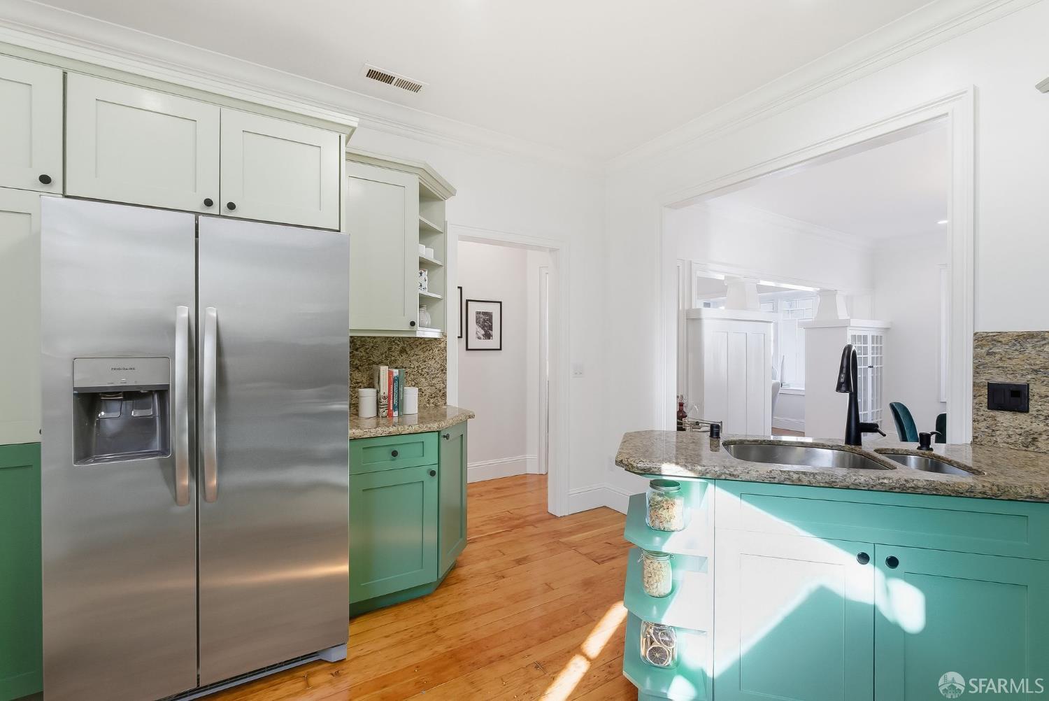 717 Page Street San Francisco, CA 94117 - Photo 12 of 39 a kitchen with stainless steel appliances granite countertop a refrigerator a sink and a stove