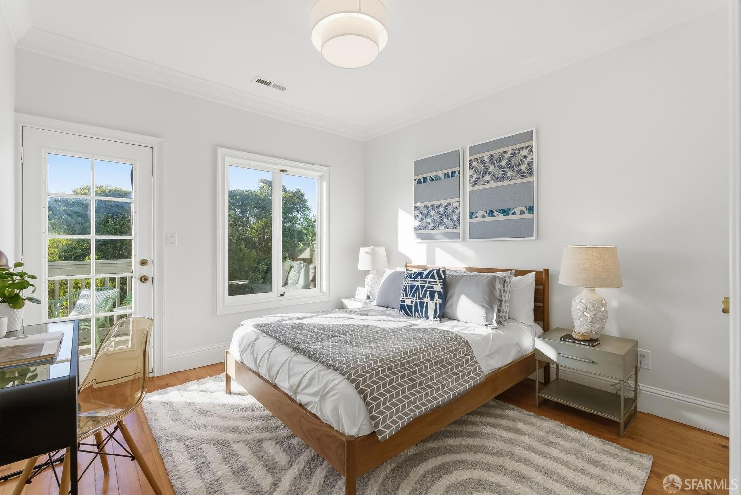 717 Page Street San Francisco, CA 94117 - Photo 14 of 39 a bedroom with a bed and a large window