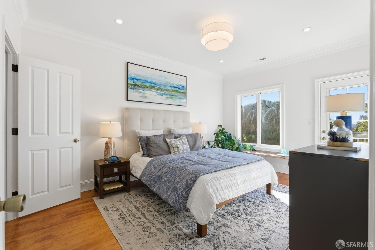 717 Page Street San Francisco, CA 94117 - Photo 16 of 39 a bedroom with a bed and a dresser