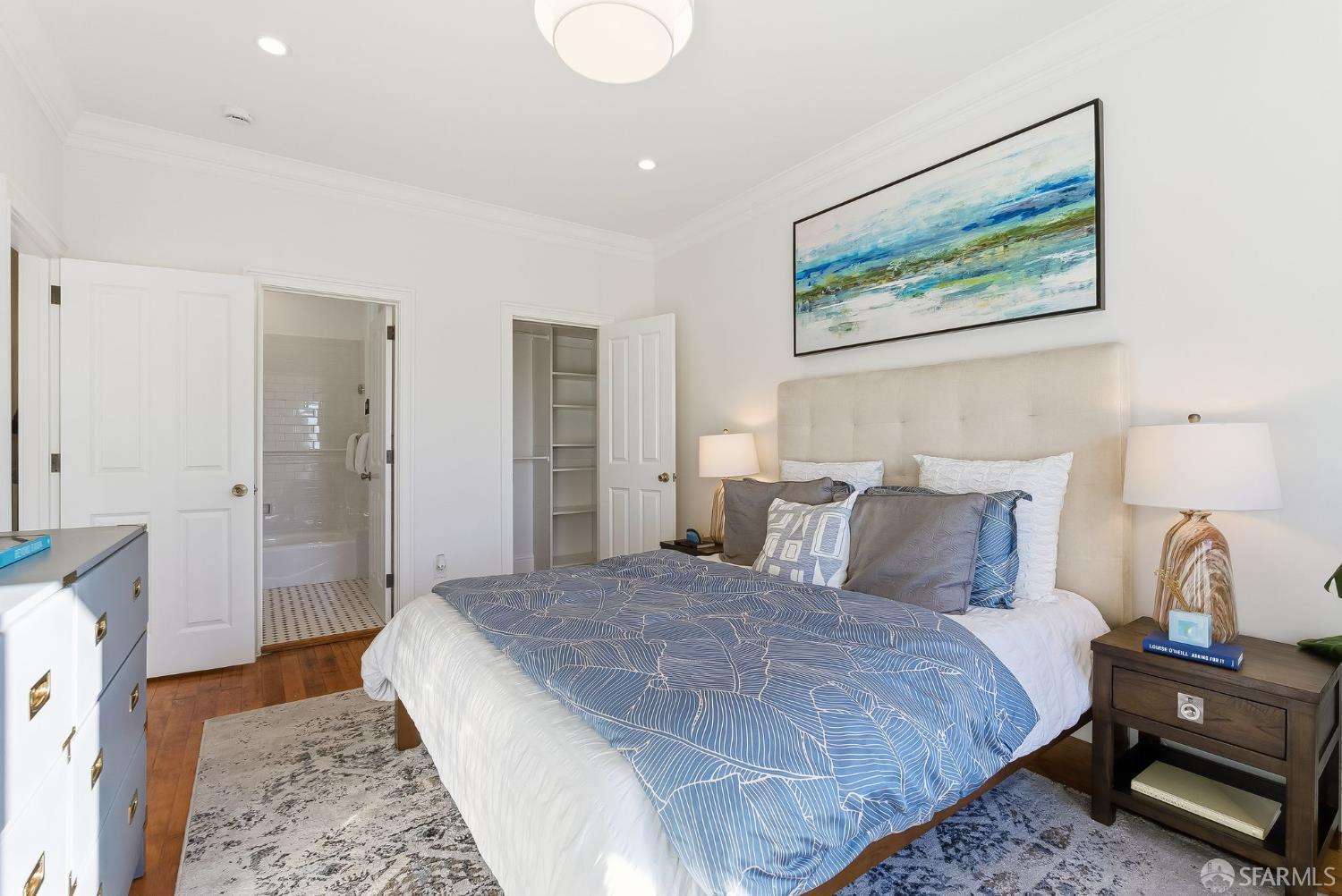 717 Page Street San Francisco, CA 94117 - Photo 18 of 39 a bedroom with a large bed and a couch