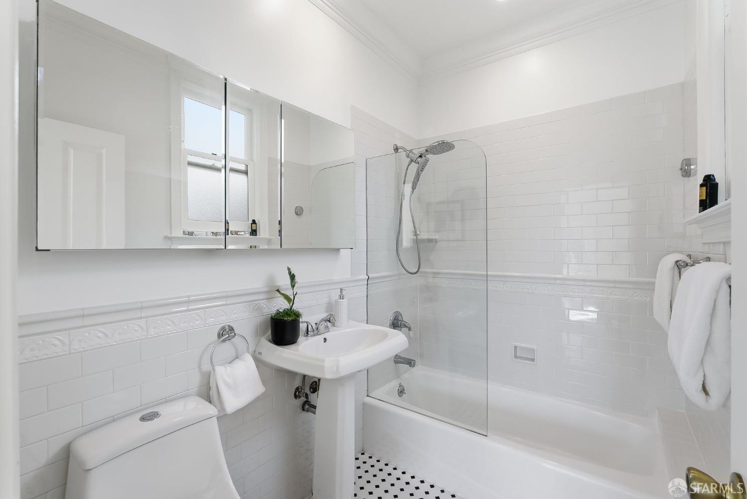 717 Page Street San Francisco, CA 94117 - Photo 21 of 39 a bathroom with a sink a toilet and shower