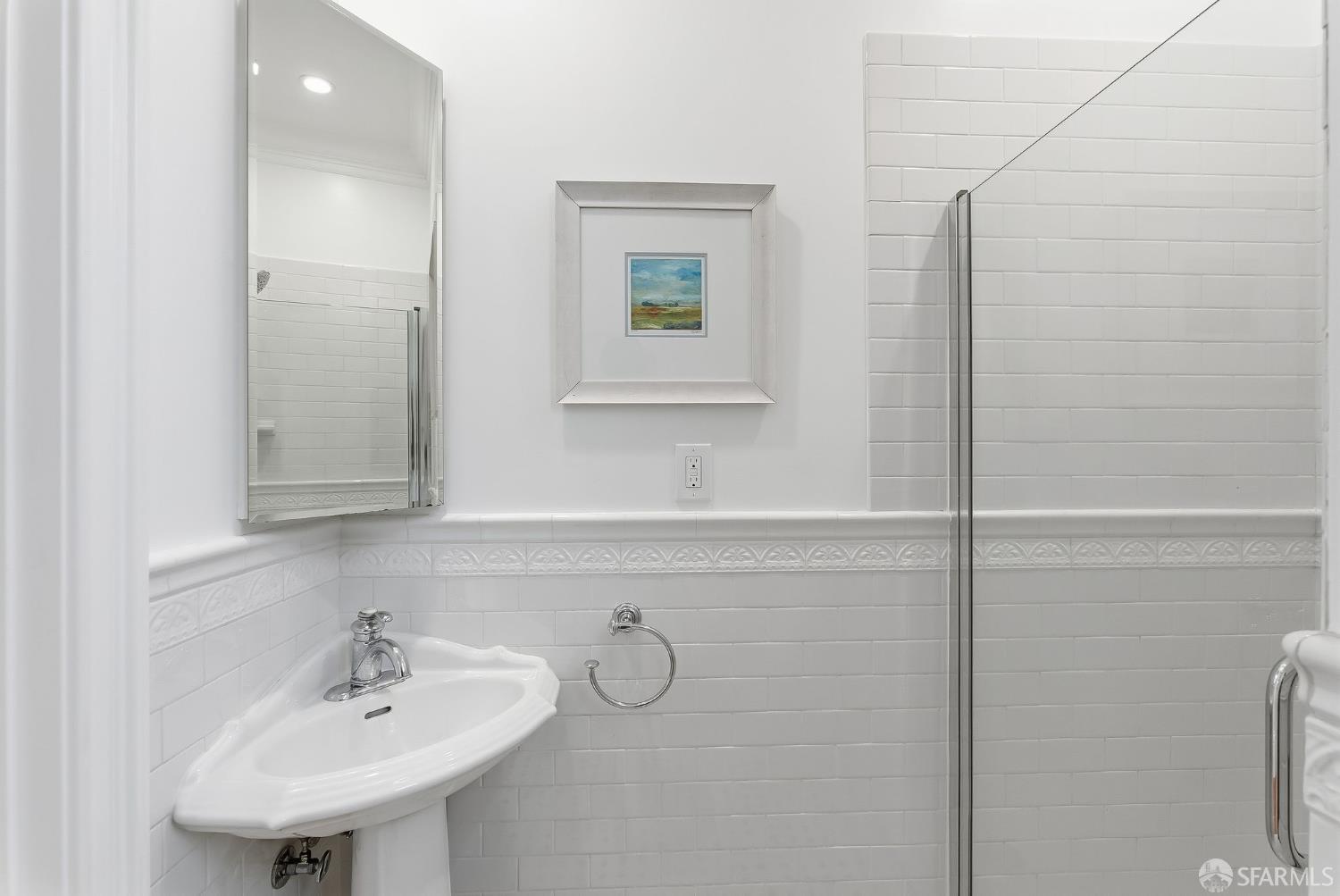 717 Page Street San Francisco, CA 94117 - Photo 22 of 39 a bathroom with a sink and a mirror