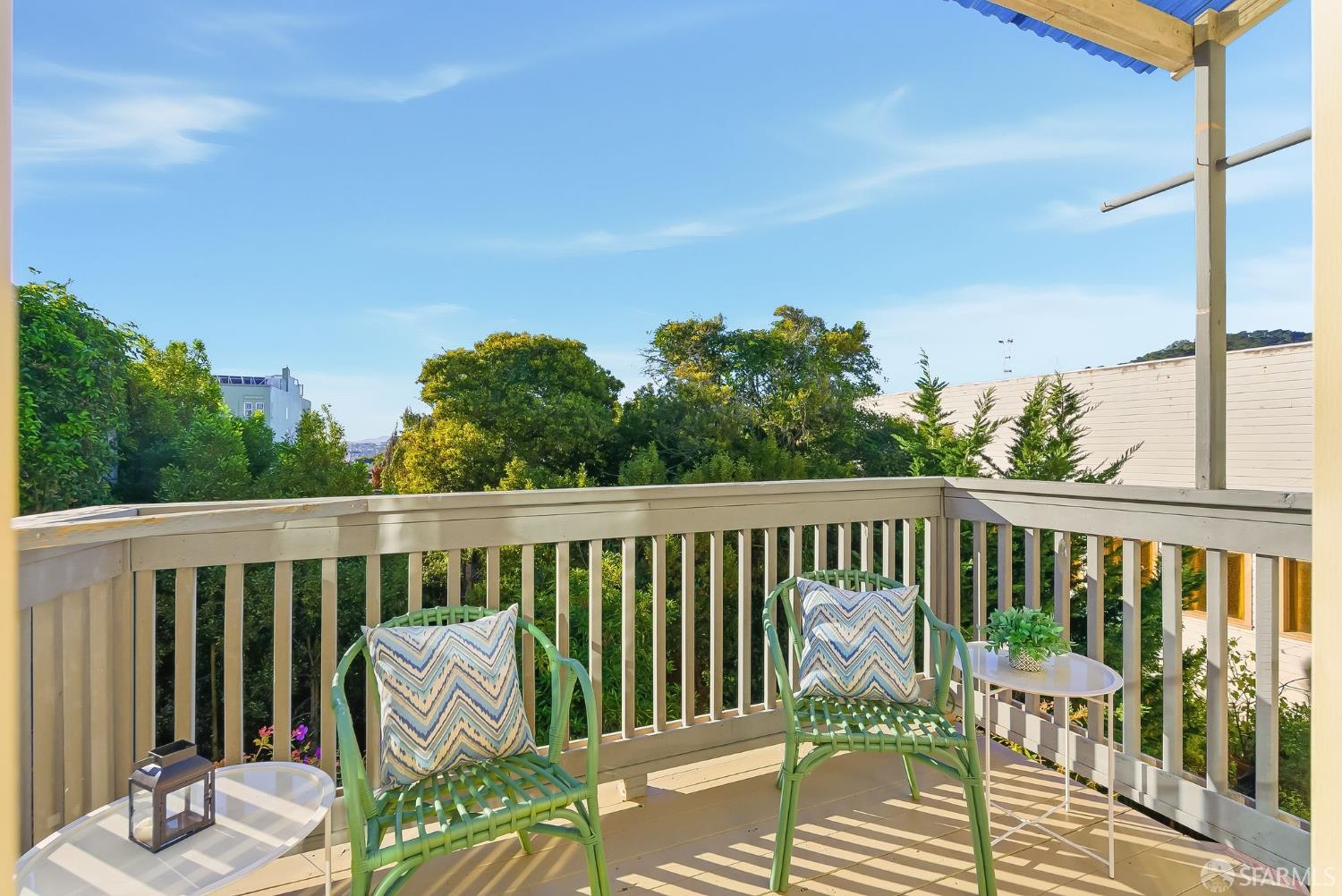 717 Page Street San Francisco, CA 94117 - Photo 24 of 39 a balcony with wooden floor table and chairs