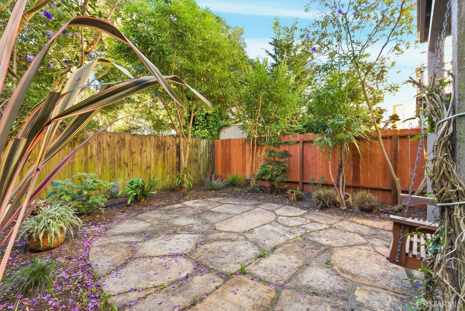 717 Page Street San Francisco, CA 94117 - Photo 32 of 39 a backyard of a house with a tree