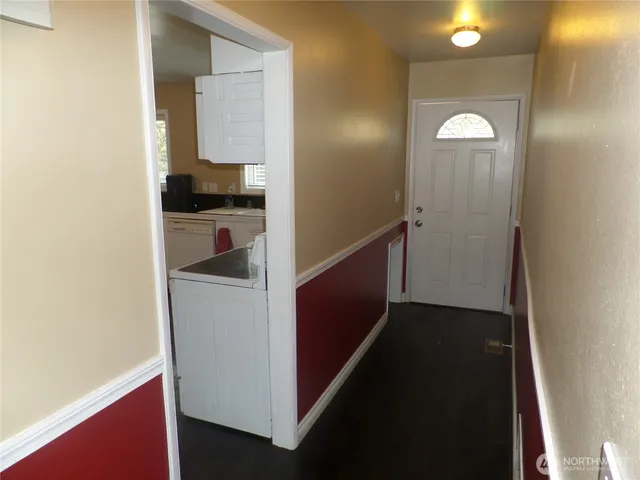 a view of hallway with cabinets