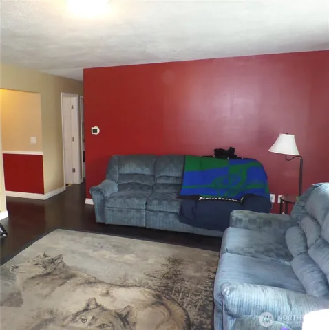 a bedroom with a bed and a lamp