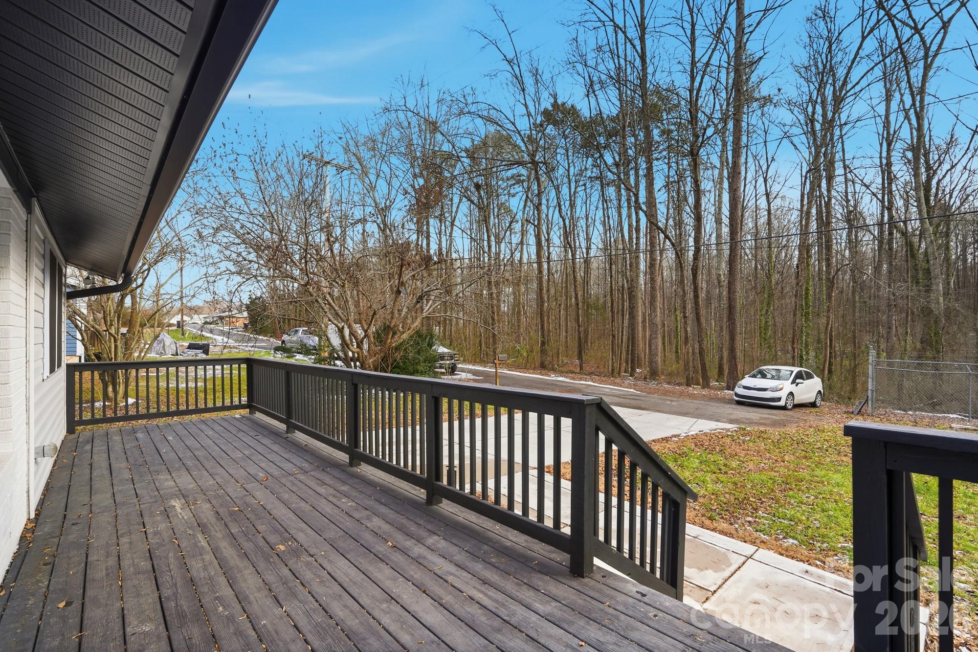 704 West Border Street Dallas, NC 28034 - Photo 14 of 48 a view of balcony with wooden floor and fence