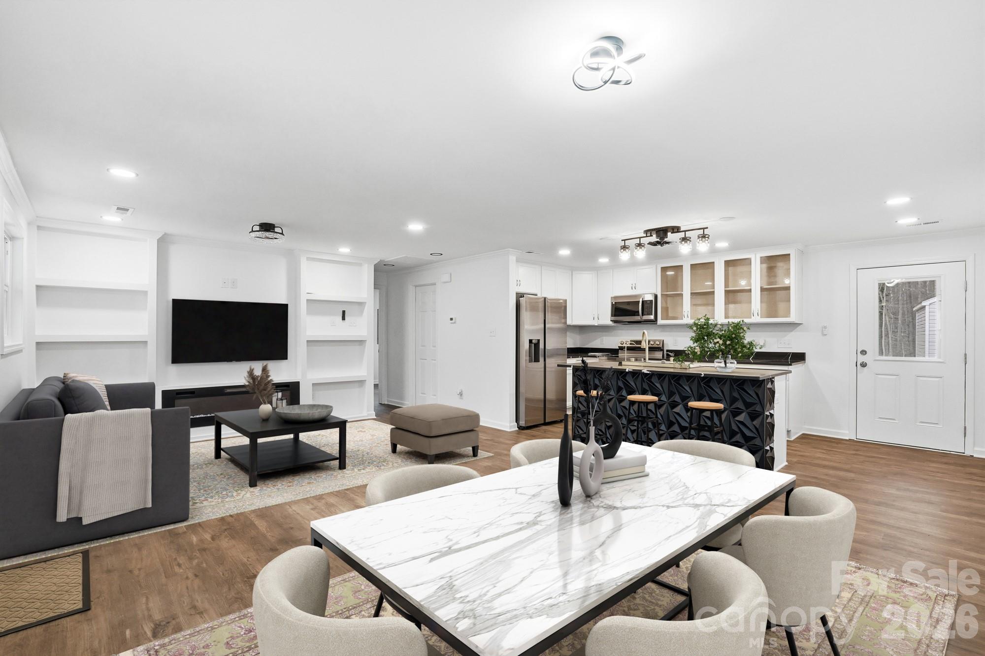 704 West Border Street Dallas, NC 28034 - Photo 2 of 48 a living room with furniture and a flat screen tv