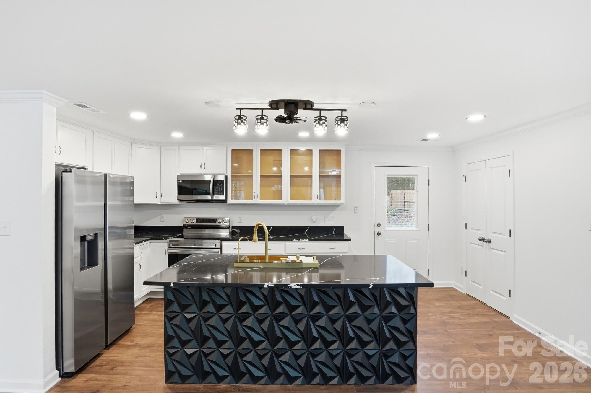 704 West Border Street Dallas, NC 28034 - Photo 24 of 48 a kitchen with stainless steel appliances granite countertop a stove and a refrigerator