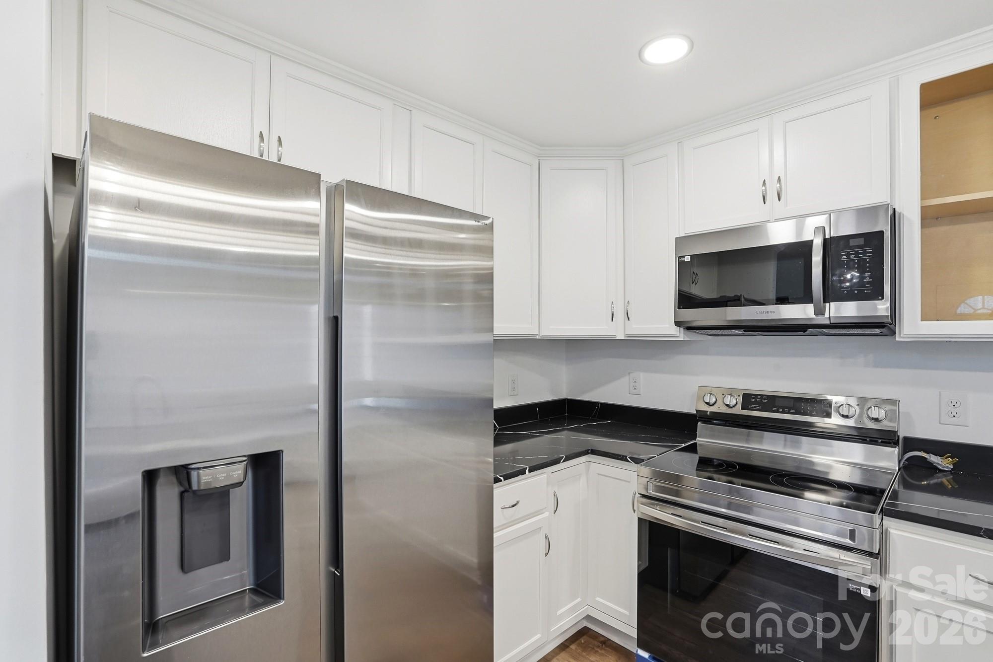 704 West Border Street Dallas, NC 28034 - Photo 26 of 48 a kitchen with a refrigerator stove and microwave