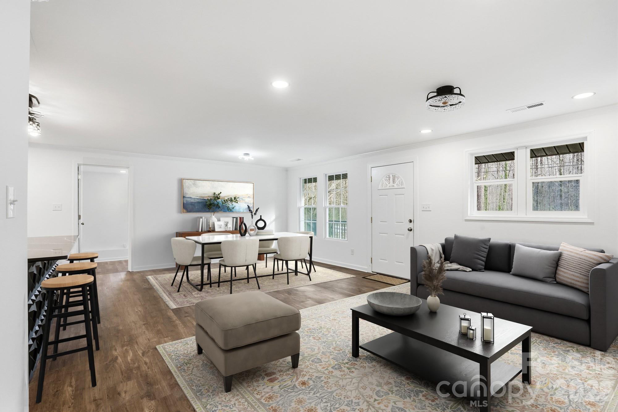 704 West Border Street Dallas, NC 28034 - Photo 3 of 48 a living room with furniture a rug and a window