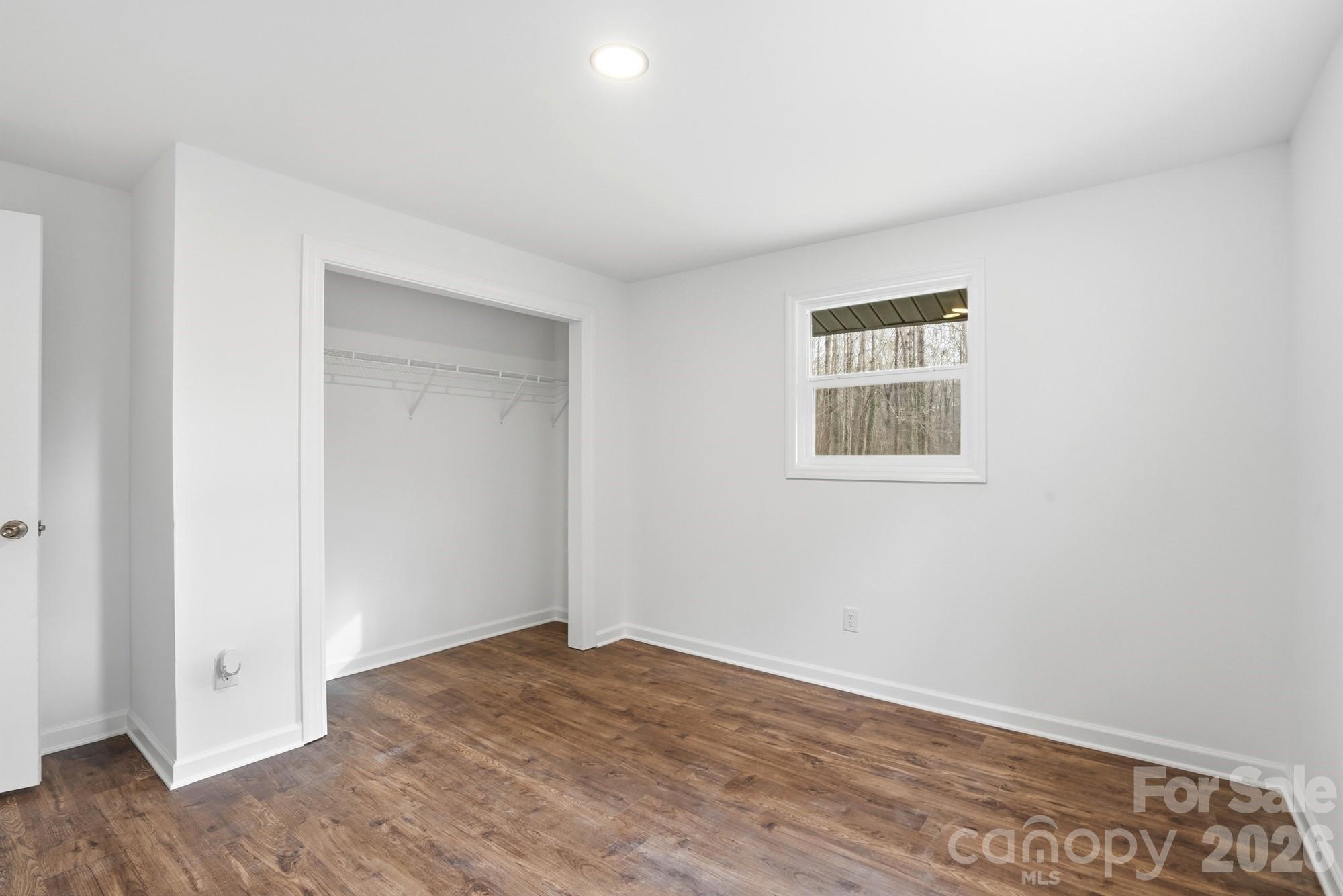 704 West Border Street Dallas, NC 28034 - Photo 35 of 48 an empty room with wooden floor and windows