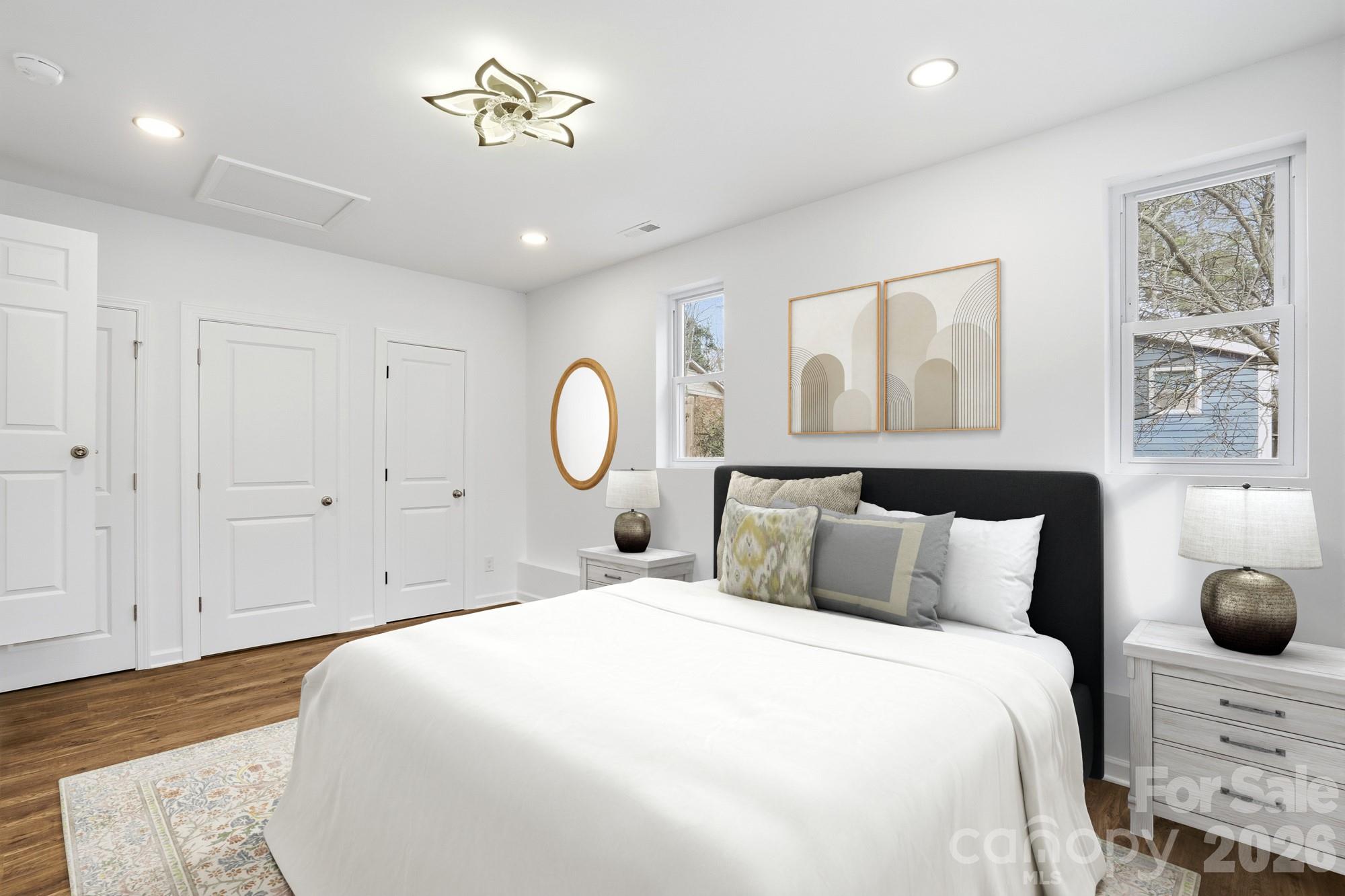 704 West Border Street Dallas, NC 28034 - Photo 4 of 48 a bedroom with a large bed and chandelier