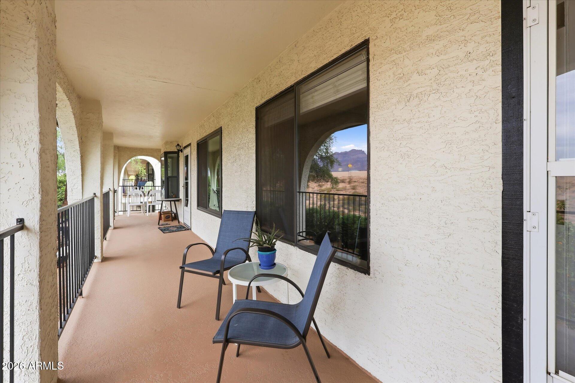 3270 South Goldfield Road, Unit 716 Apache Junction, AZ 85119 - Photo 4 of 36 a living room with furniture and a window