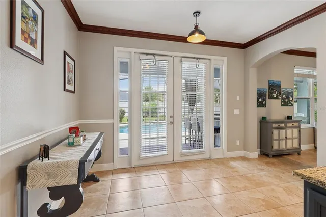 a bedroom with a bed and a ceiling fan