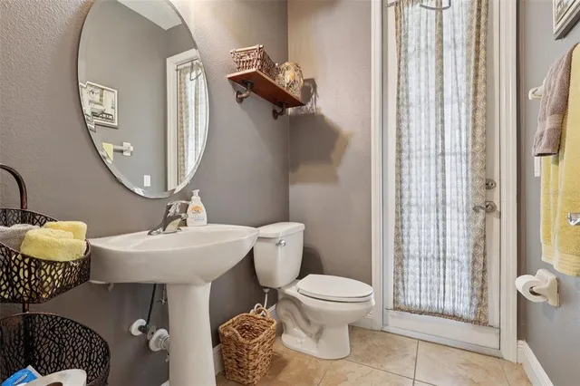 a bedroom with a bed and a tv