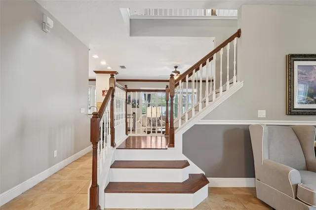 a bathroom with a granite countertop toilet sink and mirror