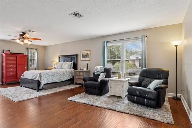 a white toilet sitting next to a bath tub
