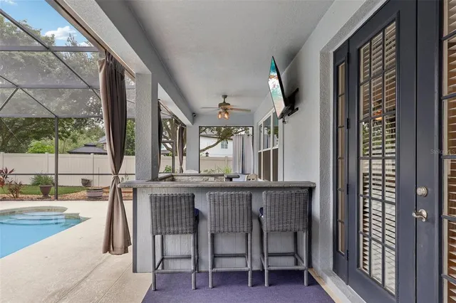 an aerial view of residential houses with outdoor space and street view